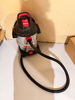 Full view of Shop-Vac with hose attached