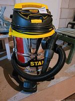 Front view of vacuum with hose attached