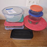 Full set of bowls and dishes stacked, lids visible