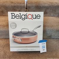 Front of retail box showing Belgique 5 QT aluminum sauté pan image and branding