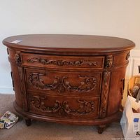 Full view of ornate brown veneer console table