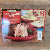 Front of boxed Daily Chef bakeware set showing three red dishes and brand information