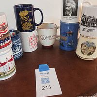 Group of all mugs on table, showing variety and condition