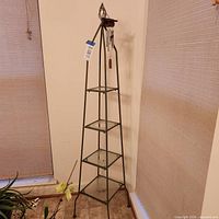 Full view of 4-tier metal and glass plant stand