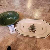 Top view of green bowl and white platter on floor