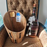 Wood planter and decorative bottle displayed together