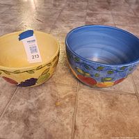 Two Sango Fruit Motif bowls, yellow interior bowl left, blue interior bowl right, fruit design visible