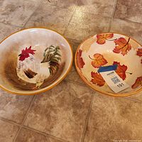 Pair of 11" ceramic serving bowls, rooster and leaf patterns