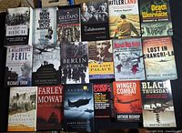 Group shot of 18 WWII nonfiction books laid out in three rows