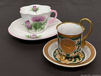 Both cup and saucer sets side by side