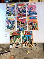 Group shot of all bagged comics on table