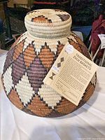 Full view of basket showing diamond pattern and lid attached