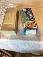 Blue factory hockey card box and plain cardboard box side by side