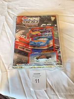 Front view of sealed Pepsi 400 Daytona blister pack with car and flyer