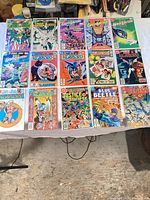 Full layout of all bagged and boarded comics on table
