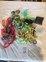 Pile of colorful bead necklaces, bracelets, loose items