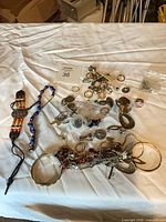 overview of entire jewelry lot on table