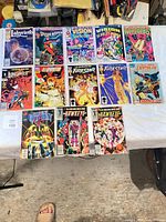 Group shot of all 13 bagged comics laid out