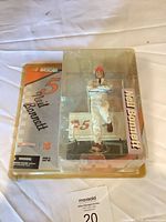 Front view of packaged Neil Bonnett action figure showing figure pose and graphics