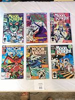 All six bagged Moon Knight comics laid out on table
