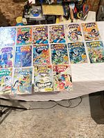 All sixteen bagged Power Pack comics laid out on table