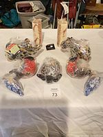 Lot overview showing two giraffe pillar candles and six wrapped animal candles
