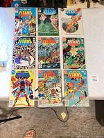 Overhead view of all nine bagged comic books laid out