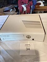 Front and top view of Xbox 360 S console