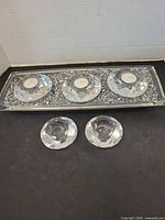 overview of tray with three candle holders and two additional holders in front