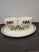 Front view of two bowls and platter showing pattern