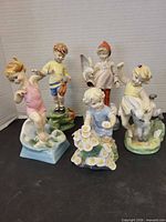 Front view of all five Royal Worcester month figurines