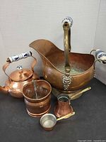 Group shot of all five copper/brass items