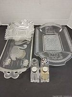 Group image: two platters, square diamond-pattern plate, four shakers