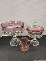 Group shot of compote, covered candy dish and creamer