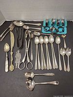 Group view of all cutlery, tongs, shears, silhouette and napkin rings