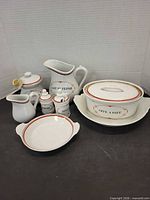Group view of all porcelain pieces showing form, trim and labels