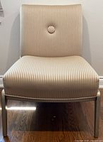 Front view of armless striped accent chair