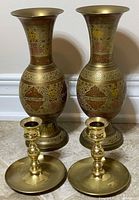 Front view of both vases and candlesticks