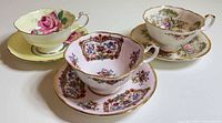 Three Paragon teacup and saucer sets front view