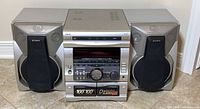 Front view of stereo system showing main unit and both speakers
