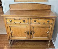 Front view of oak sideboard with drawers and doors closed