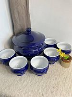 Full set showing blue tureen with lid and six matching bowls