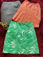 Three skirts laid out showing colors and styles