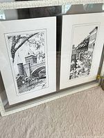 Framed pair of sketches side by side in white frame