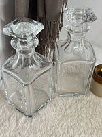 Both square Baccarat decanters front view
