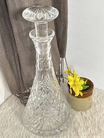 Full view of crystal decanter with stopper