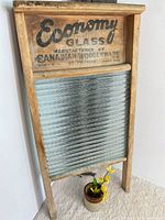 Full front view of washboard showing frame, glass panel and branding