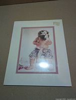 Front view of sealed matted print showing image and matting
