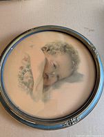 Full view of framed round lithograph