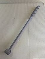 Full length view of cast iron auger drill bit